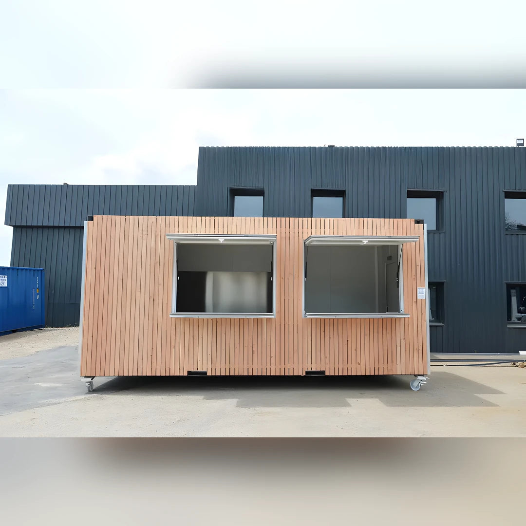 Bungalow modulaire Eurocontex – façade bardage bois avec grandes fenêtres coulissantes sur roulettes