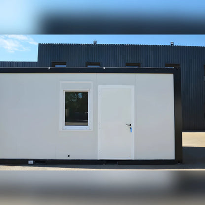 Bungalow bureau Eurocontex – vue de face, panneau blanc avec fenêtre et porte métallique